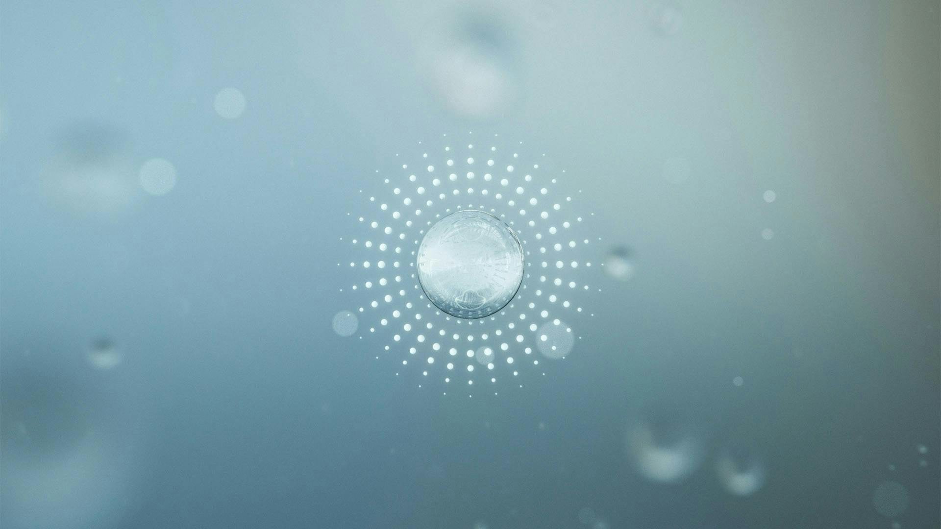 Bubbles in a blue enivorment with depth of field. A field of dots around the bubble in the center.